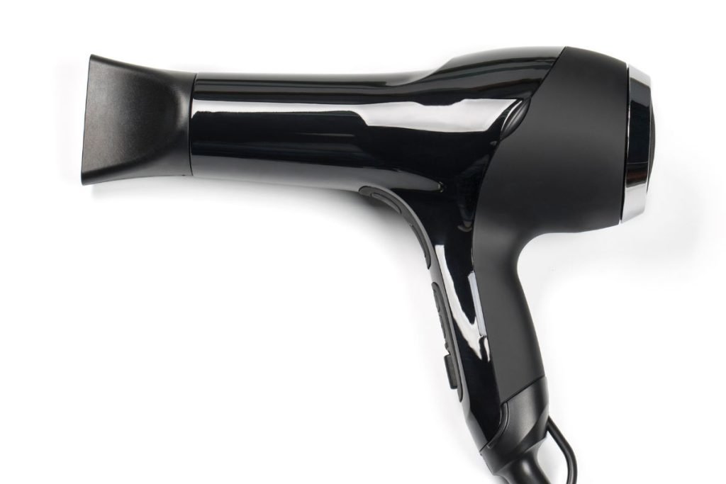 A sleek black hair dryer positioned on a clean white background, showcasing its modern design and functionality.